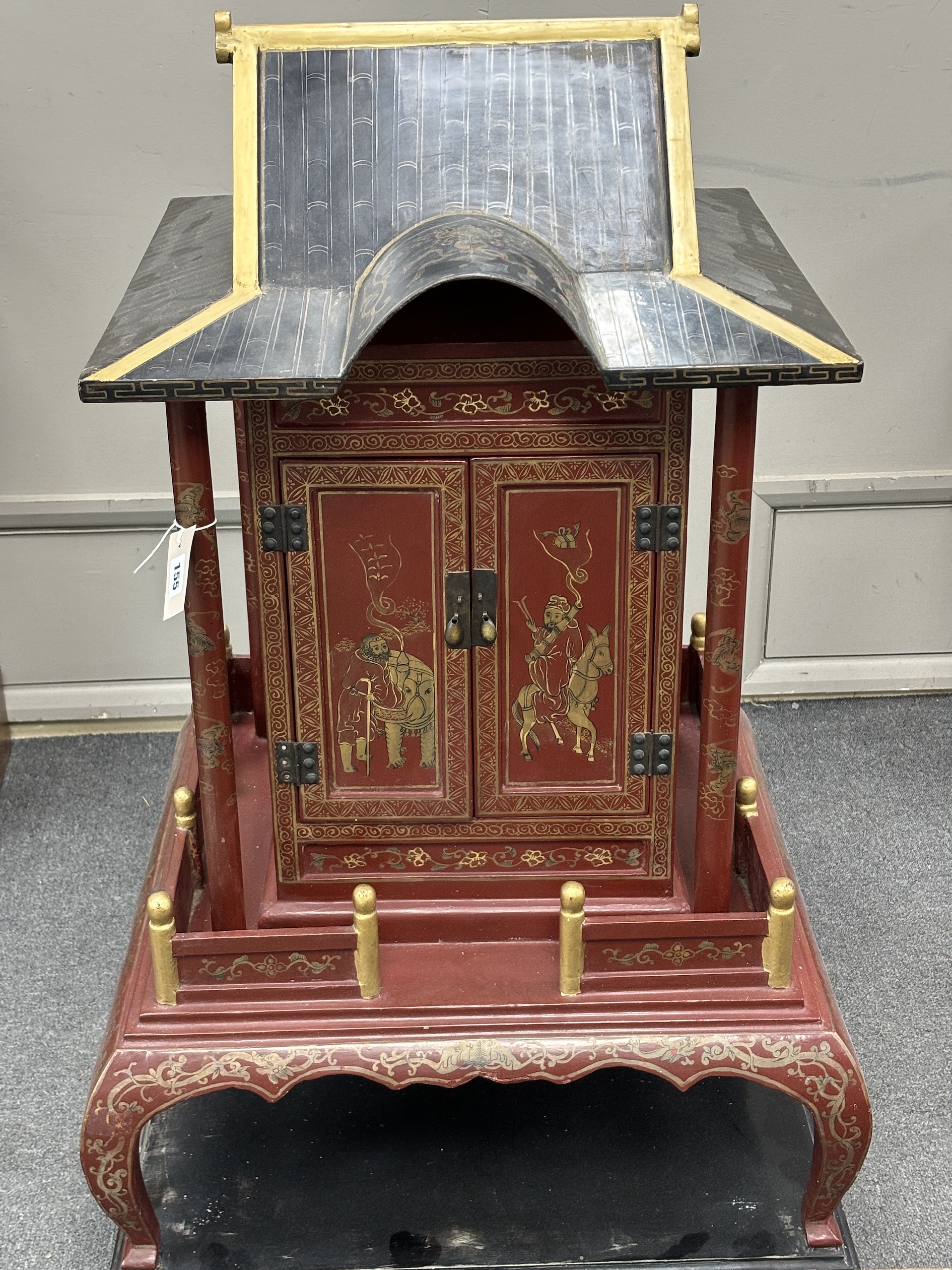 A Chinese scarlet and black lacquer temple shrine, height 112cm